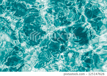 Blue transparent water with flecks of sunshine 125147626