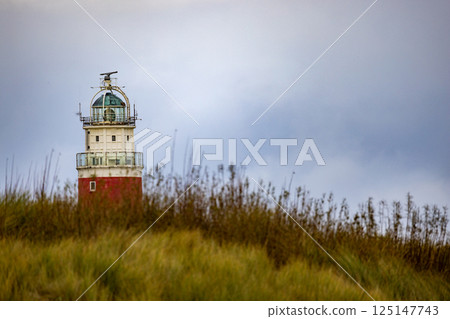 Eierland, De Cocksdorp, Texel, The Netherlands, Oktober 28th, 2024, This charming lighthouse stands Eierland, De Cocksdorp, Texel, The Netherlands, Oktober 28th, 2024, This charming lighthouse stands 125147743