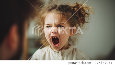 A child cries while parents argue in the background. The crying child highlights the emotional pain and turmoil caused by parental arguments. Generative AI. 125147954