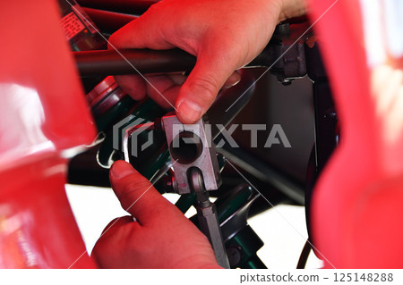 Racing car stabilizer adjustment work_01 Racing car stabilizer adjustment work_01 125148288