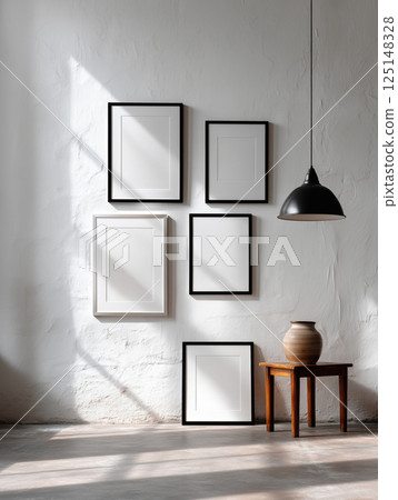 Modern art gallery interior with blank canvases on white walls, soft lighting, and minimalist wooden flooring. Perfect for artwork showcasing. High quality photo 125148328