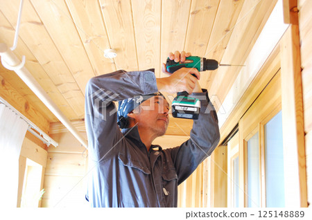 DIY Man drilling holes with an electric drill Part 1 DIY Man drilling holes with an electric drill Part 1 125148889