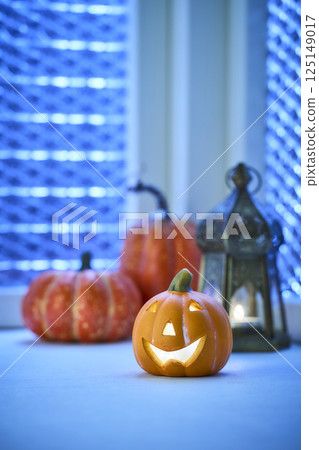 Halloween image of a decorated window at night 125149017