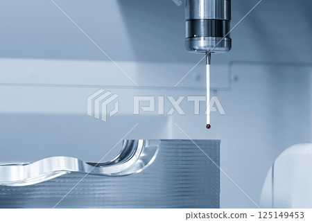 The CMM machine measuring the injection mold parts in the light blue scene. 125149453