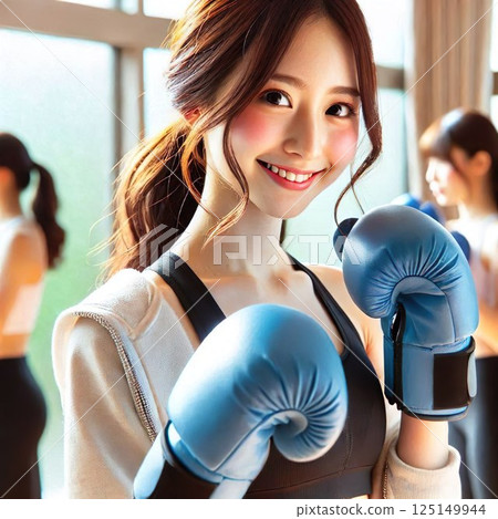 Woman with boxing gloves ready to train at the gym 125149944
