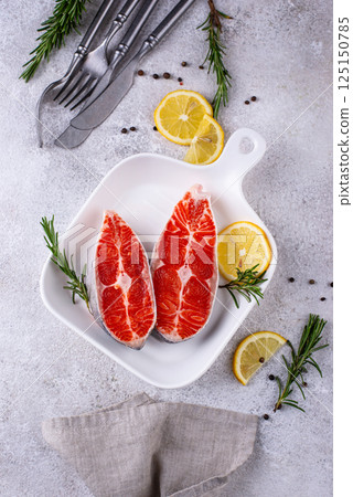 Raw uncooked salmon with rosemary 125150785