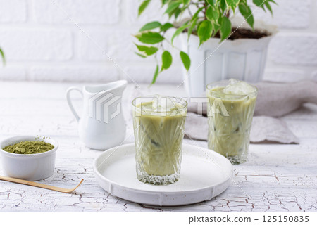 Cold matcha tea with milk and ice Cold matcha tea with milk and ice 125150835