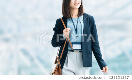Woman/businesswoman walking in the office Woman/businesswoman walking in the office 125151227
