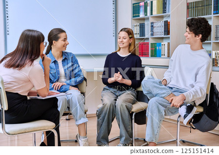Group teamwork, students teenagers sitting in circle with female mentor, counselor 125151414