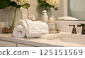 Serene Bathroom Sanctuary with Perfectly Arranged Towels and Toiletries for a Rejuvenating Self-Care Routine 125151569