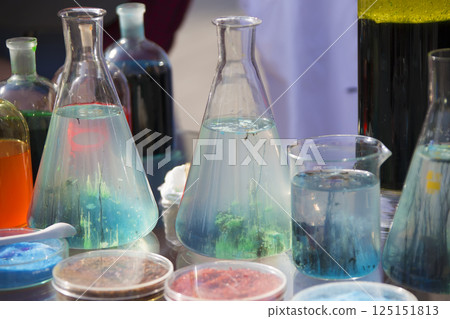 Glass flasks with colored powder 125151813