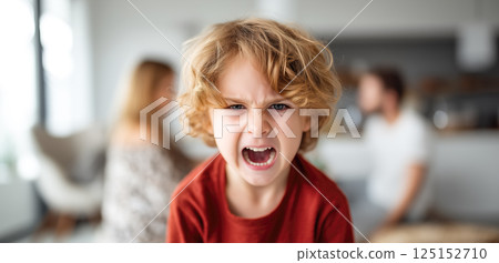 A child cries while parents argue in the background. The crying child highlights the emotional pain and turmoil caused by parental arguments. Generative AI. 125152710