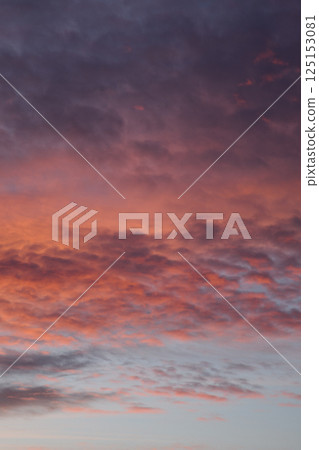 Various colors of the sunset. Fluffy clouds. Romantic sky. Universal vertical photo. The background picture. Various colors of the sunset. Fluffy clouds. Romantic sky. Universal vertical photo. The background picture. 125153081