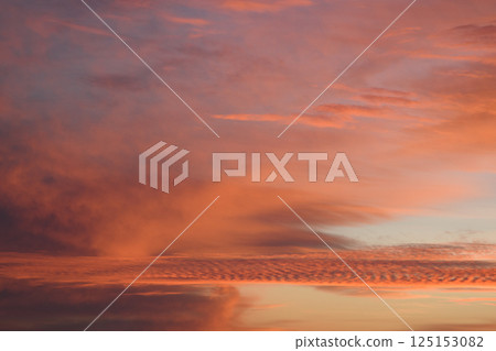 Romantic. Incredibly beautiful sunset. Pink clouds. Universal horizontal picture. The background picture.  125153082