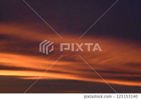 Bright clouds at sunset. Pink, blue romantic sky. Light breaks through the clouds. Universal photos. The background picture.  125153140