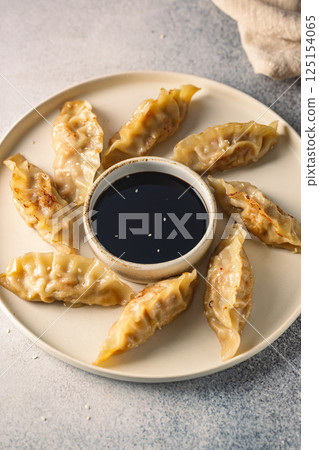 Asian dumplings with soy sauce 125154065