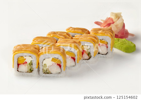 Delicious sushi rolls covered with cheese sauce and mango filling on white background 125154602