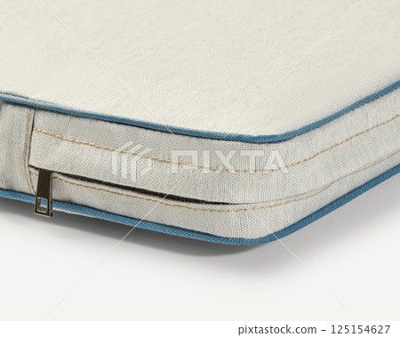 Close-up of removable cushion cover with zipper showing high-quality fabric and stitching 125154627