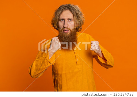 Aggressive angry Caucasian man trying to fight at camera, shaking fist, boxing, punishment, threaten Aggressive angry Caucasian man trying to fight at camera, shaking fist, boxing, punishment, threaten 125154752
