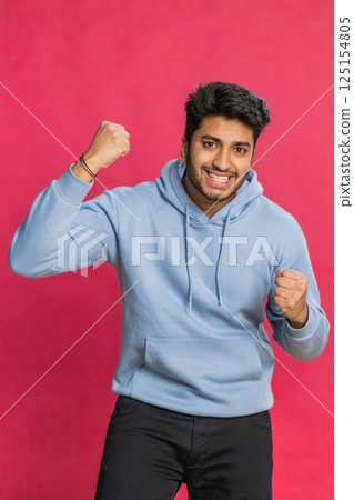 Happy Indian man celebrating success, winning, birthday, lottery jackpot goal achievement, good news Happy Indian man celebrating success, winning, birthday, lottery jackpot goal achievement, good news 125154805
