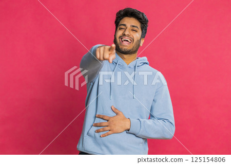 Happy excited Indian man laughing out loud after hearing ridiculous anecdote, reaction on funny joke Happy excited Indian man laughing out loud after hearing ridiculous anecdote, reaction on funny joke 125154806