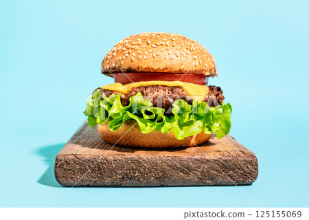 Beef burger, cheeseburger on blue background, Beef burger, cheeseburger on blue background, 125155069