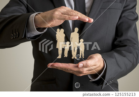 Businessman protecting family silhouette with a father mother baby and two children Businessman protecting family silhouette with a father mother baby and two children 125155213