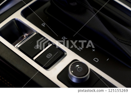 Selector automatic transmission with leather in the interior of a modern expensive car. The background is blurred. 125155269
