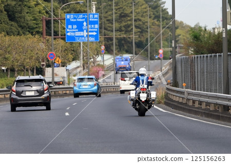 Image of a police motorcycle on patrol 125156263