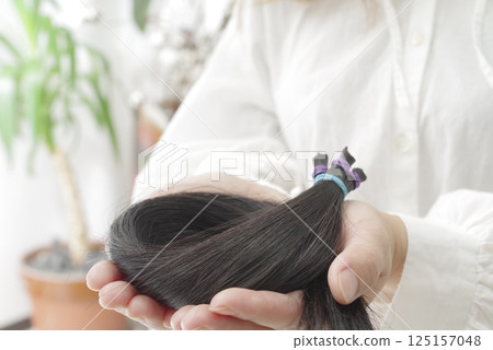 Hair tied up for hair donation Hair tied up for hair donation 125157048