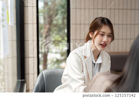 Communication and Sustainability. Women professionals strategizing for a greener future. 125157142
