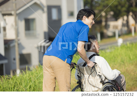 Senior men riding a wheelchair 125157232