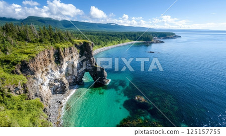 Stunning coastal landscape with rocky cliffs and pristine blue ocean. 125157755
