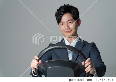 Salaryman holding the wheel 125159393