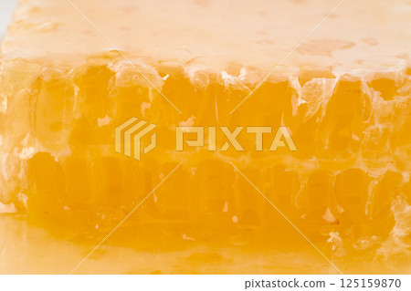 A close-up of the cross section of comb honey 125159870