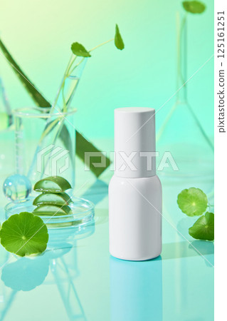 Cylindrical cosmetic bottle mockup without label, used for design. Transparent laboratory jars contain natural essences. Aloe vera and centella are ingredients with many benefits for skincare. Cylindrical cosmetic bottle mockup without label, used for design. Transparent laboratory jars contain natural essences. Aloe vera and centella are ingredients with many benefits for skincare. 125161251