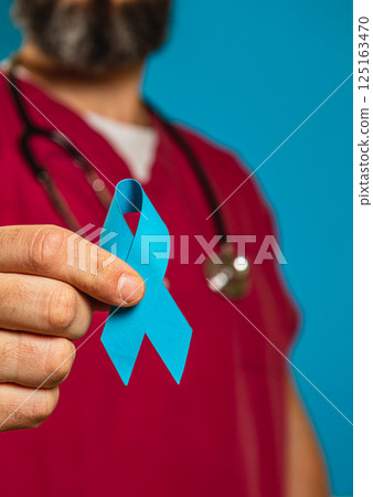 Support for Health Awareness with Blue Ribbon in Medical Setting 125163470