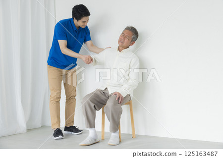 Senior men sitting in a chair Senior men sitting in a chair 125163487