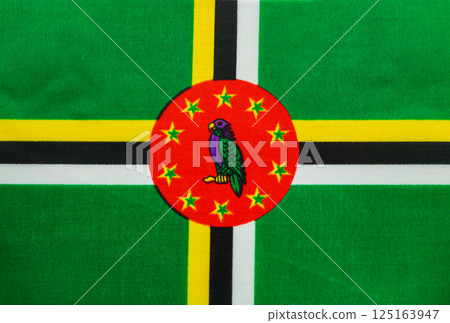 Dominica's national flag displayed in vibrant colors 125163947