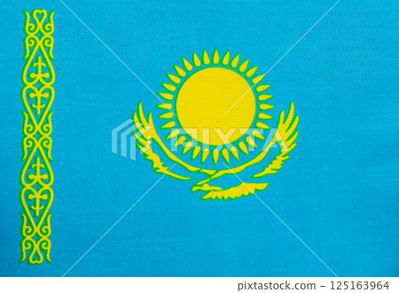 Kazakhstan flag with sun and eagle design displayed 125163964
