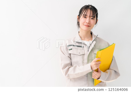 Young female engineer who wants to be trusted White background Young female engineer who wants to be trusted White background 125164006