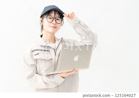 System engineer holding a PC, white background System engineer holding a PC, white background 125164027