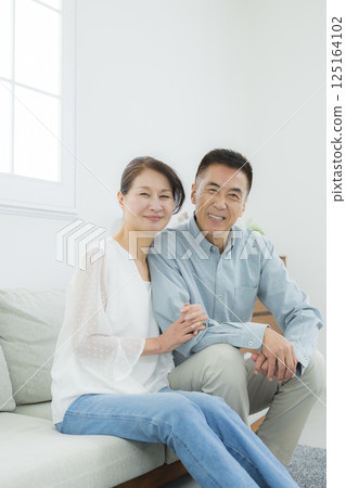 Senior couple in the living room Senior couple in the living room 125164102