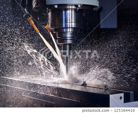 CNC milling machine processing on steel with cooling CNC milling machine processing on steel with cooling 125164410