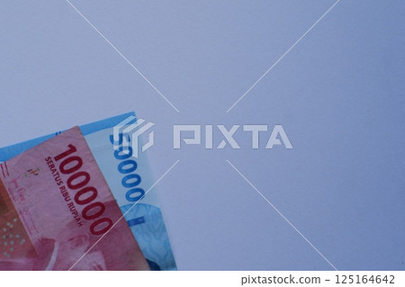 100 thousand and 50 thousand rupiah notes with a white background 125164642