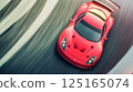 Red supercar drifting on a winding asphalt track 125165074