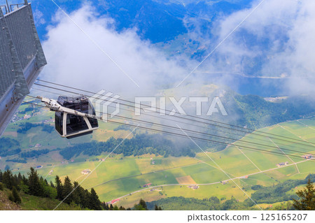 Gondola of Stanserhorn cabrio cable car to Stanserhorn mountain in Switzerland 125165207