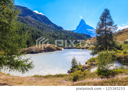 View of Moosjisee lake and Matterhorn mountain at summer on the Five Lakes Trail in Zermatt, Switzerland 125165233