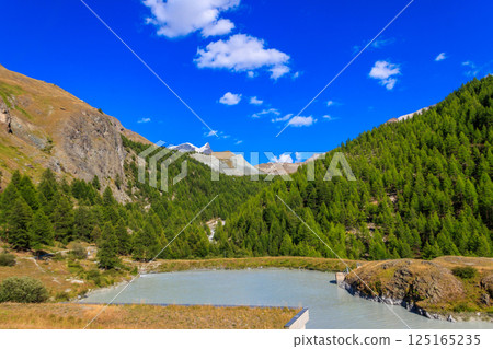 View of Moosjisee lake and the Swiss Alps at summer on the Five Lakes Trail in Zermatt, Switzerland 125165235