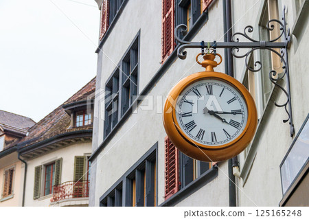 Close-up of big clock on the building in Switzerland 125165248